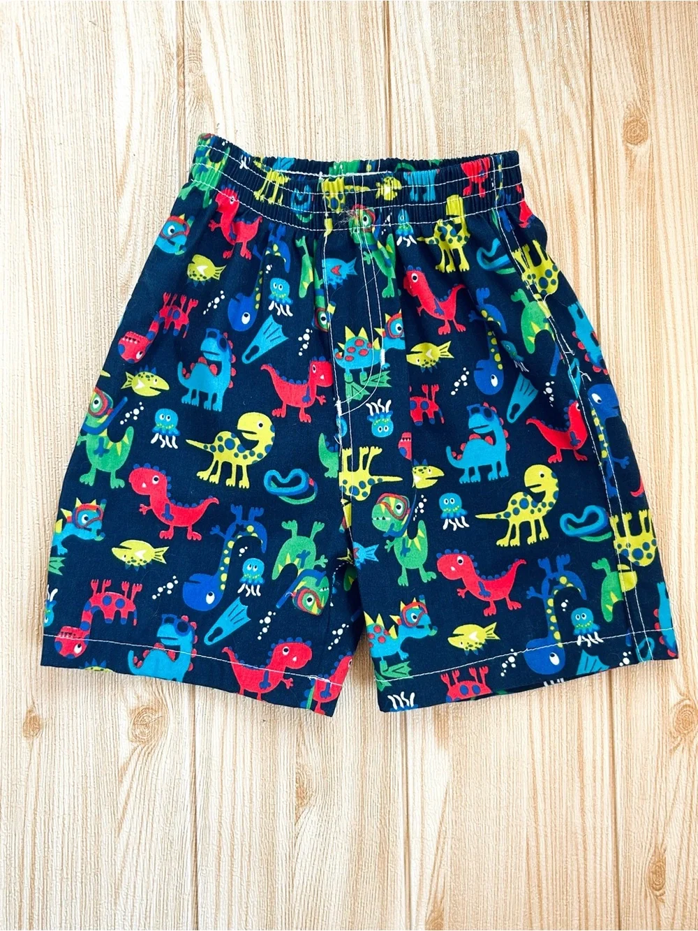 Boys sz 2T / 24 M Navy Blue Swim Trunks Shorts Dinosaur